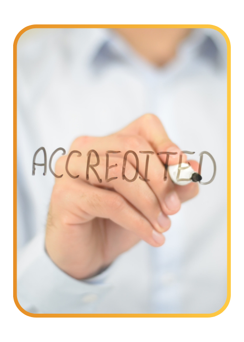 A person writing accredited on a whiteboard